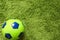 Football Soccer ball on a green surface imitating artificial grass. Sports photography