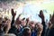 Football- soccer fans support their team and celebrate goal in full stadium with open air