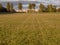 Football soccer field, Grass in focus, goal post out of focus, Cloudy sky