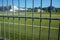 Football or soccer pitch seen through fence
