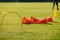 Football Soccer Training Equipment on Practice Session. Soccer Cones and Goal on Soccer Pitch