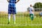 Football Training Game for Kids. Young Boy as a Football Goalkeeper Standing in a Goal