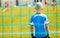 Football Training Game for Kids. Young Boy as a Football Goalkeeper Standing in a Goal