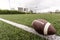 Football on Yardage Marker. Low Angle. Horizontal View