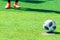 Footballer foot standing near the penalty spot ready to kick pernalty on soccer pitch. Sport Determination and fearless concept