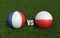 Footballs in flags colors on soccer field. France with Poland . 3d