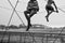 Footbridge across the Vistula River. Figures of circus performers.