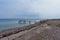 Footbridge on the coast with sandy beach