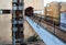 Footbridge connecting street sidewalk with entrance to apartment