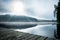 Footbridge with fog on a lake