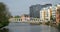 Footbridge over the River Great Ouse at Bedford with trees and modern buildings.