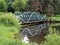 Footbridge Reflecting in Pond
