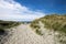 A footpath along dunes to Refsnesstranda beach in a nice sunny day near Naerbo