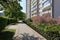 Footpath along large multifamily building is empty