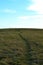 Footpath through autumn meadow rising to the horizon, Karvina, Northern Moravia, Czech Republic