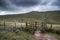 Footpath in Brecon Beacons landscape leading to Corn Du peak wit