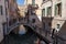 Footpath Bridge in a narrow Canal. Venice.