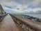 Footpath following the coastline around San Sebastian`s old town at the mouth of the Urumea