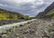 Footpath at Laugara river valley to Seljavallalaug abandoned theramal swimming pool in South Iceland, green hillos and