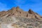 Footpath leading to jagged hills on Titus Canyon Road in Death Valley National Park, California, USA