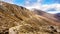 Footpath leading to snow capped peak of Slieve Donard mountain.