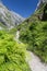 Footpath in mountains Picos de Europa, Spain and the person on h