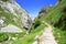 Footpath in mountains Picos de Europa, Spain, in summer sunny da