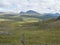 Footpath in northern artic landscape, tundra in Swedish Lapland with green hills and mountains at Padjelantaleden hiking