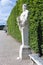 Footpath with ornamental statues in the garden Palace Versailles Paris, France