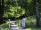 Footpath over little bridge in a summer forest