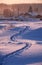 Footpath traces in the snow in russian Altai village in Winter