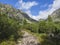 Footpath trail from Strbske Pleso, beautiful nature with pine trees and rocky montain peak, High Tatras mountain, Slovakia, late s