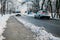 Footpath By Vehicles Moving On Road During Winter