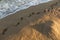 Footprints flooded with sea water on the beach sand in the Calella area