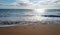 Footprints at golden sand, footsteps. Calm sea beach background. Summer tropical beach with sand. Ocean water. Natural