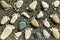 Footprints from pebble stones on beach sand