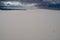 Footprints in the rippled wavy white gypsum sand in White Sands