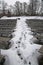 Footprints in the snow between the benches of the amphitheater of Sigulda castle