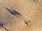 Footprints, tracks and shadows on sand