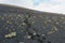 Footprints in the volcanic sand climbing the slope of the San Antonio Volcano in La Palma