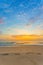 The footprints were showed on the sand in sea and sunset view with blue sky