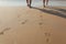 Footprints in wet sand