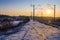 Footsteps along the railway tracks in winter at sunset