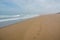 Footsteps at seashore fading into the distance