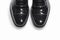 Footwear Concept. Closeup of Pair of Stylish Classic Formal Male Stylish Black Polished Oxford Leather Laced Shoes Placed Together