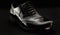 Footwear Concept. Horizontal Image. Pair of black female classic leather shoes on the black background.