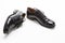 Footwear Concepts. Closeup of Pair of Male Stylish Black Polished Derby Calf Leather Laced Shoes Placed Randomly on Side