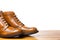 Footwear Concepts.Closeup of Tips of Pair of Tanned Brogues Boots