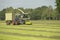 Forage harvester and transport grass with green tra