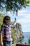 Forced perspective view of a pretty female appearing to be holding lighthouse